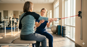  An injured accident victim in physical rehabilitation, representing the long-term medical losses documented in a truck accident claim